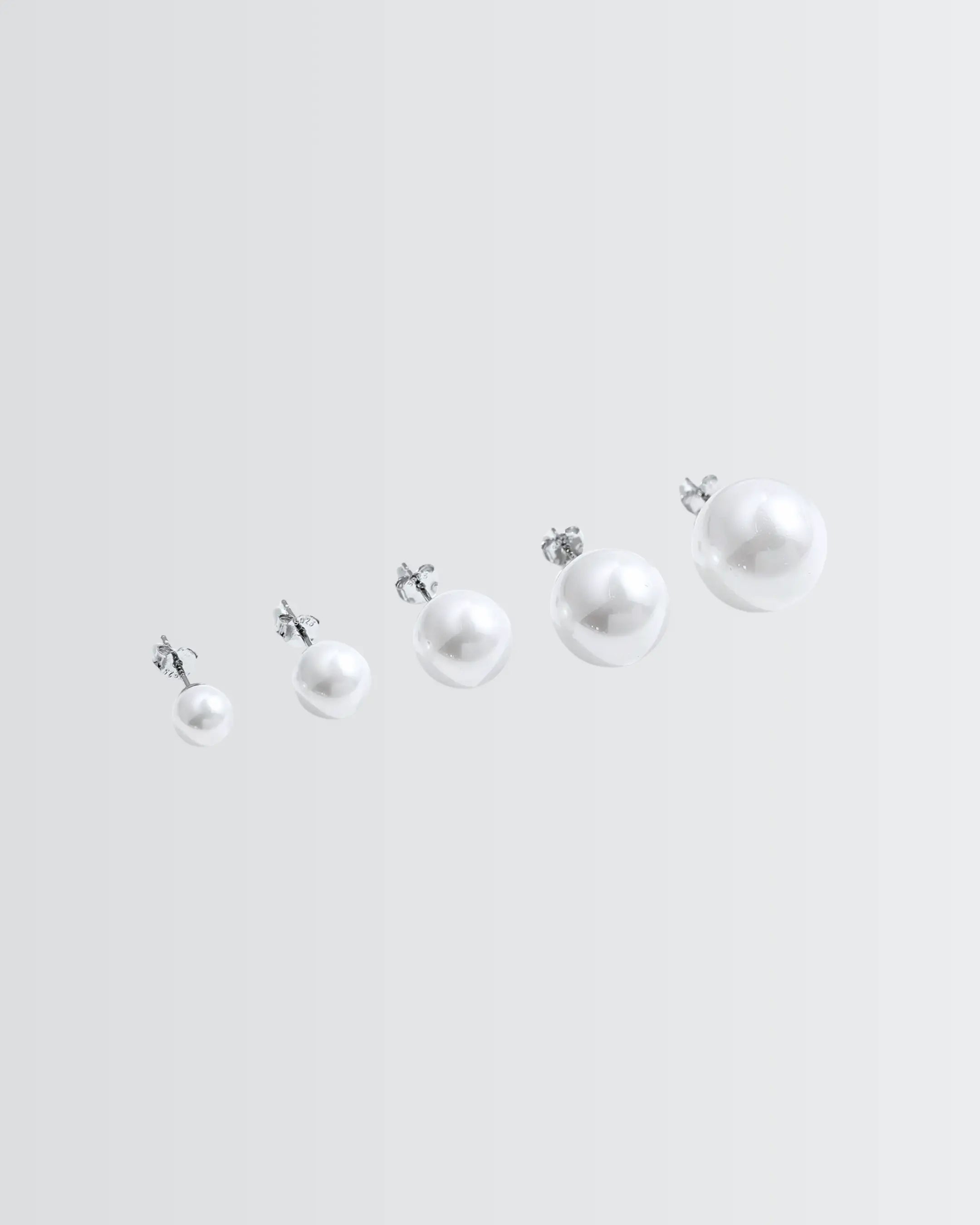 Gleaming Pearl Studs - Silver Earrings by BLINGLANE